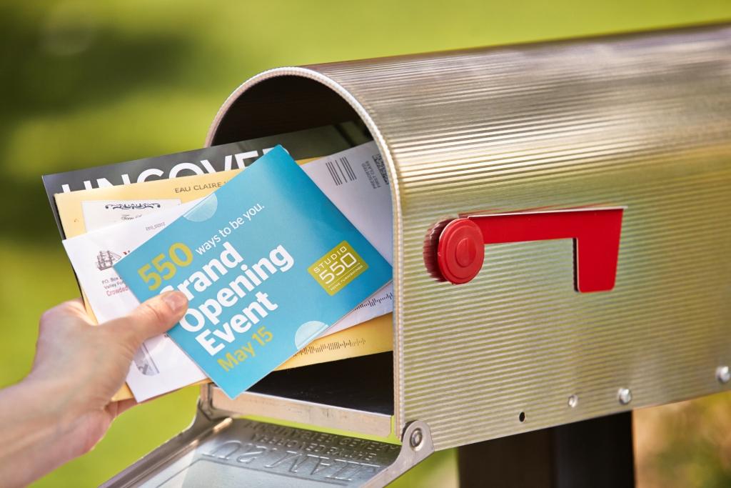Direct mail being placed in a mailbox in Oklahoma City.